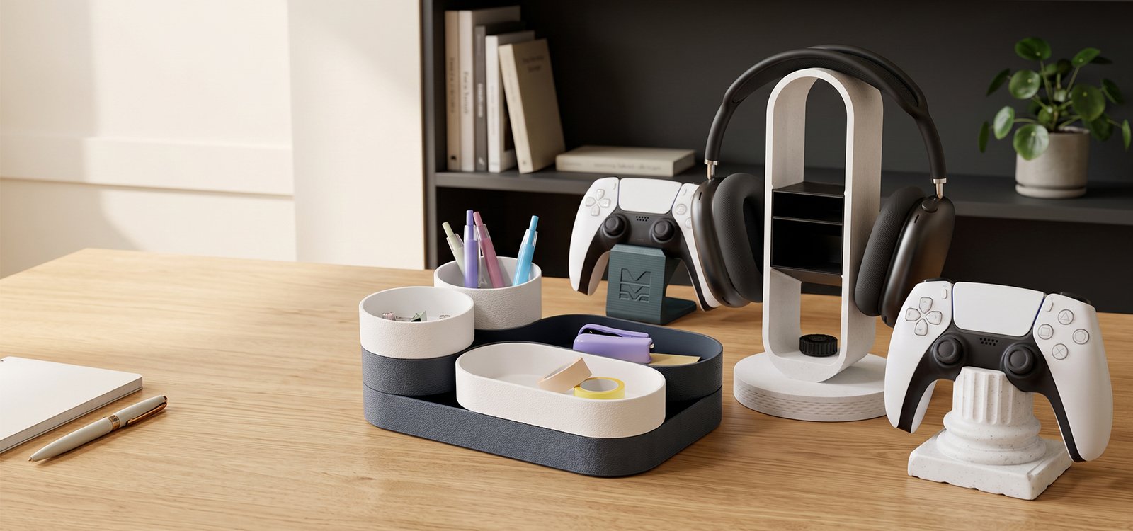 The Morpiq product range on a desk — modular desk tray, pen cups, headphone stand and controller stands